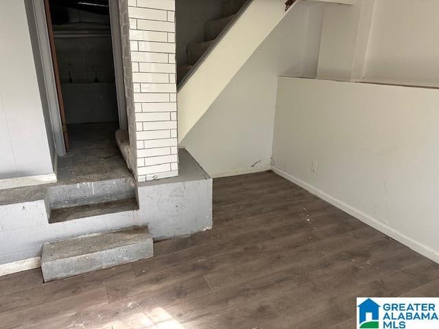 staircase with hardwood / wood-style flooring