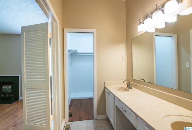 bathroom with hardwood / wood-style flooring and vanity