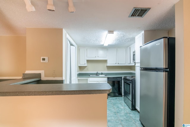 kitchen featuring kitchen peninsula, a textured ceiling, sink, black appliances, and white cabinets