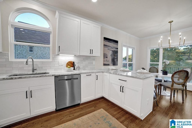 kitchen with white cabinets, stainless steel dishwasher, a healthy amount of sunlight, and sink