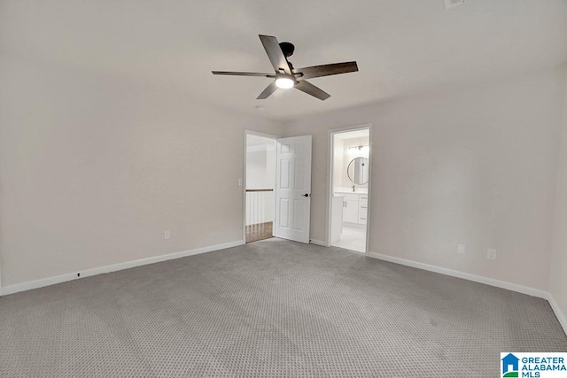 unfurnished bedroom featuring ensuite bath, ceiling fan, and carpet floors