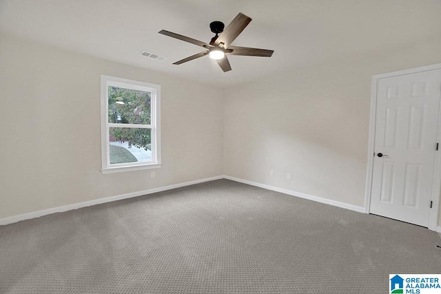 empty room with carpet and ceiling fan