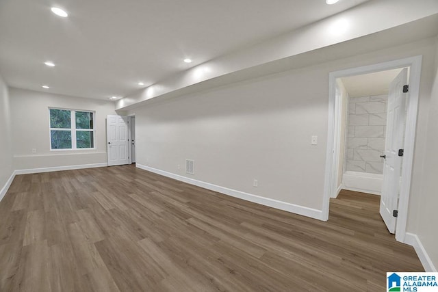 unfurnished room featuring hardwood / wood-style flooring