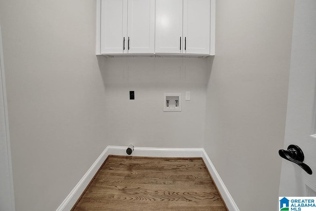 clothes washing area with hookup for a washing machine, cabinets, and hookup for an electric dryer