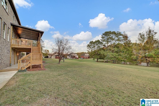 view of yard with a wooden deck