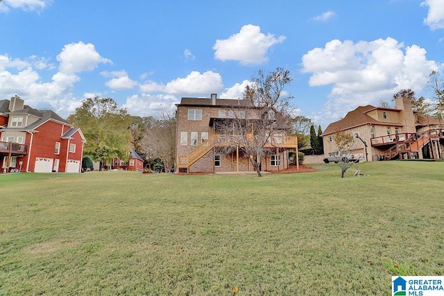 view of yard featuring a garage and a wooden deck