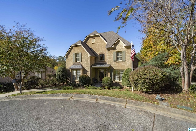2399 Huntington Glen Dr, Homewood, AL 35226 - traditional-style home with a standing seam roof and metal roof