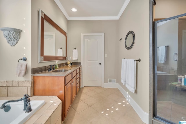 bathroom featuring tile patterned floors, crown molding, vanity, and separate shower and tub