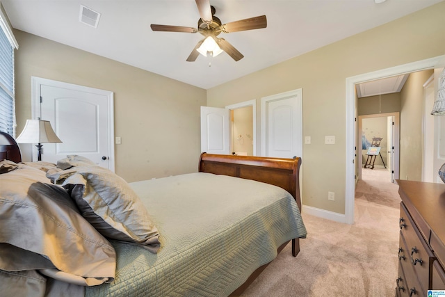 bedroom with light carpet and ceiling fan