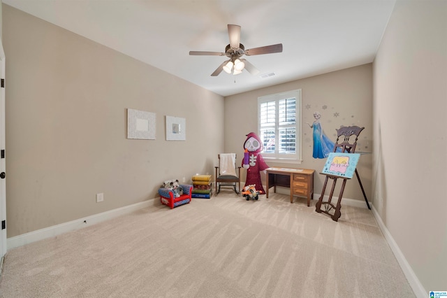 playroom with light colored carpet and ceiling fan