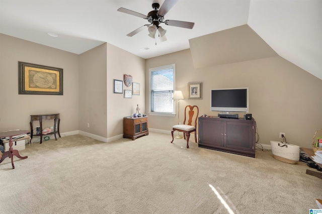 living area with light carpet, ceiling fan, and lofted ceiling