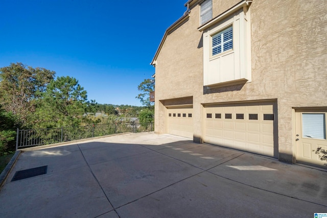 view of property exterior featuring a garage