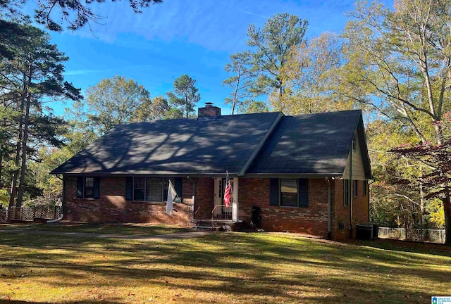 view of front facade with central AC unit and a front lawn