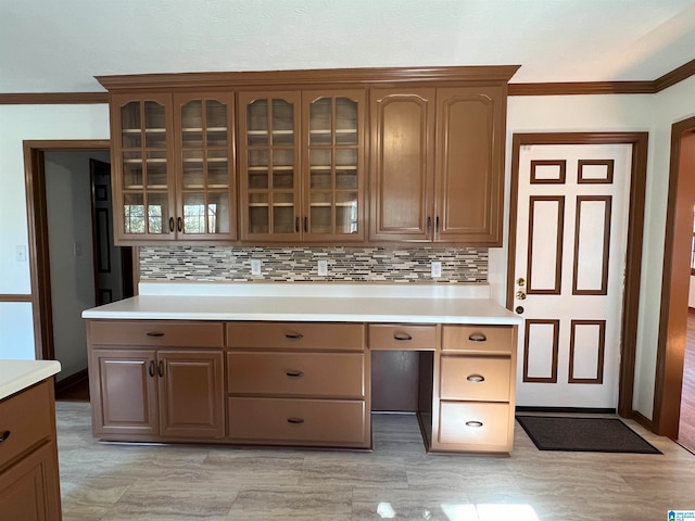 kitchen with tasteful backsplash and crown molding