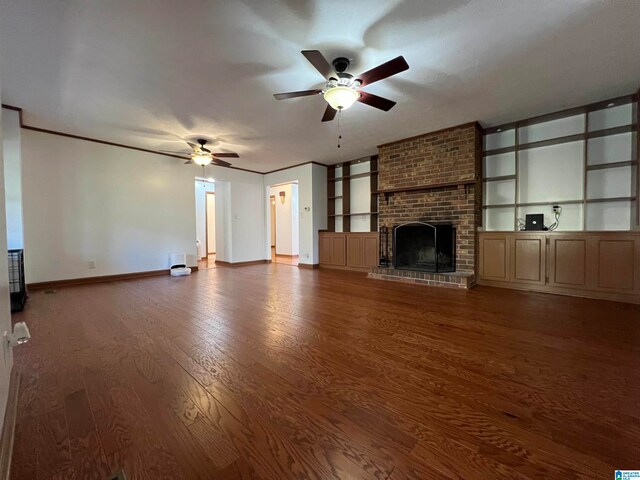 unfurnished living room with a fireplace, ceiling fan, and hardwood / wood-style floors