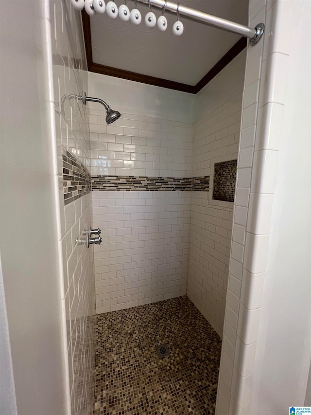 bathroom with a tile shower