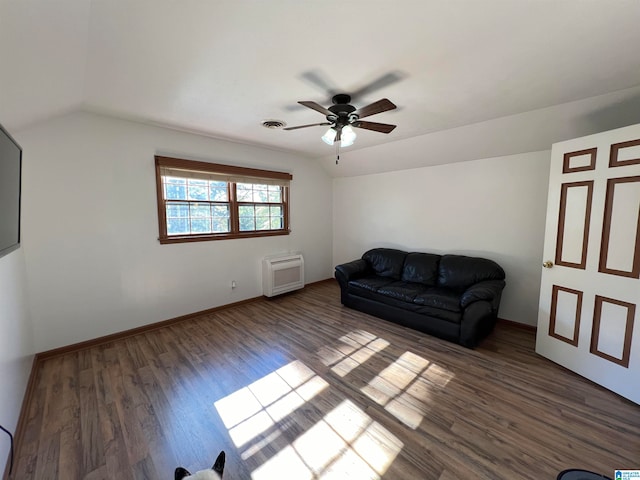 living room with a wall mounted air conditioner, dark hardwood / wood-style floors, ceiling fan, and lofted ceiling