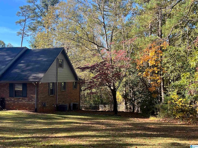 view of property exterior featuring a yard and cooling unit