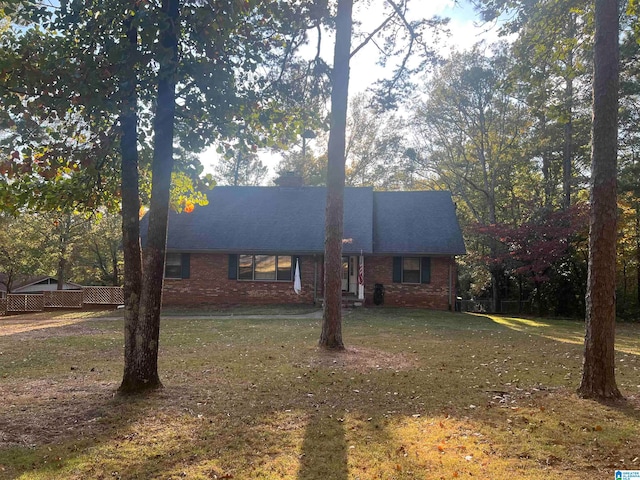 ranch-style home with a front lawn