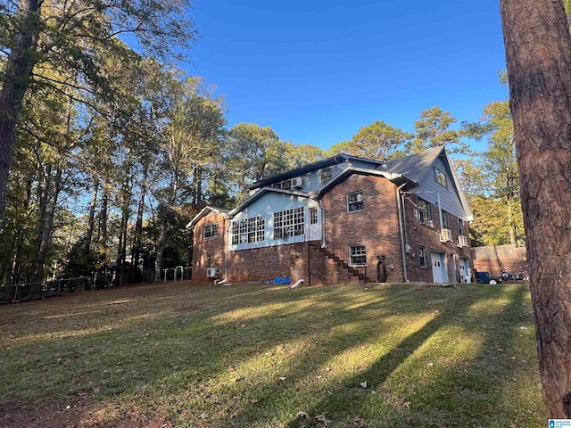 view of property exterior with a lawn and a garage