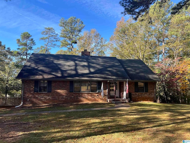 ranch-style home with a front lawn