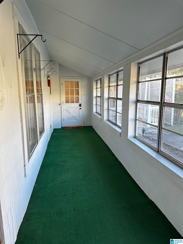 unfurnished sunroom with vaulted ceiling