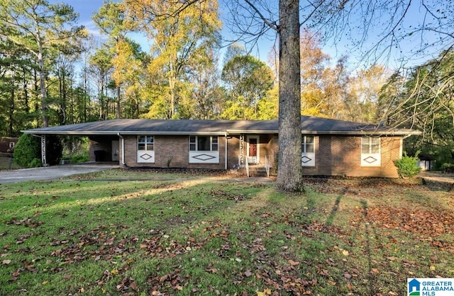 ranch-style house with a front lawn and a carport