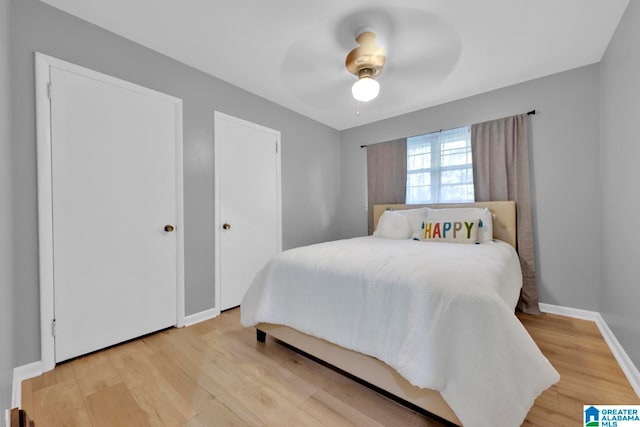 bedroom featuring light hardwood / wood-style flooring and ceiling fan