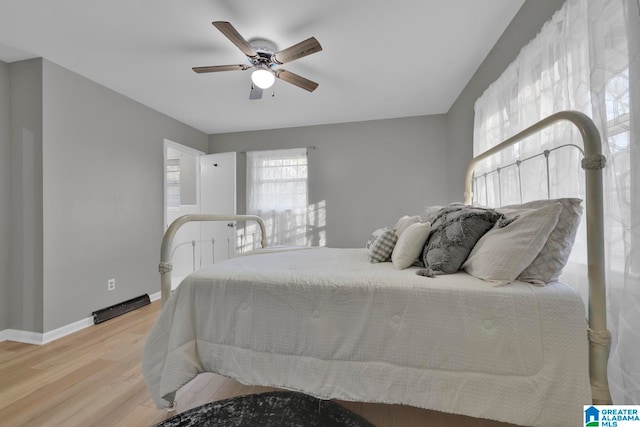 bedroom with ceiling fan and light hardwood / wood-style flooring