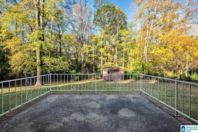 view of patio with a storage shed