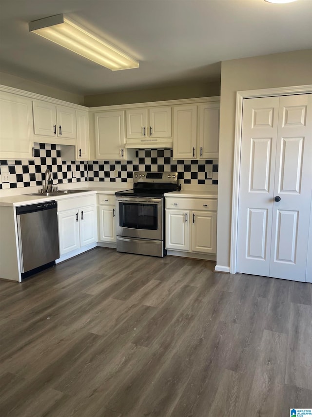 kitchen featuring decorative backsplash, white cabinetry, sink, and appliances with stainless steel finishes