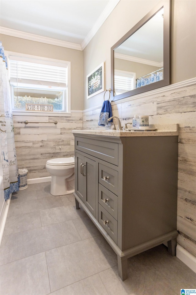 bathroom featuring vanity, tile patterned floors, and crown molding