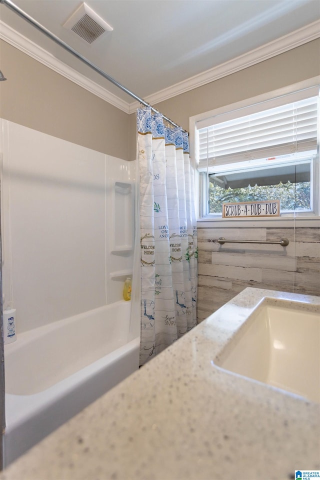 bathroom featuring shower / bath combo and crown molding