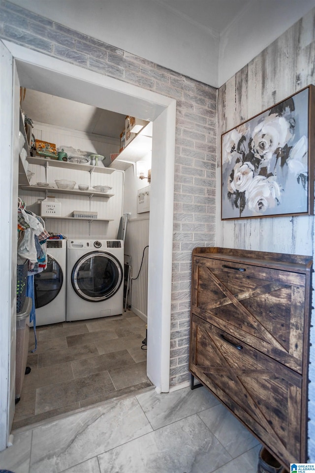 laundry area with washing machine and dryer