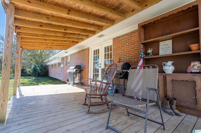 wooden deck featuring french doors and grilling area