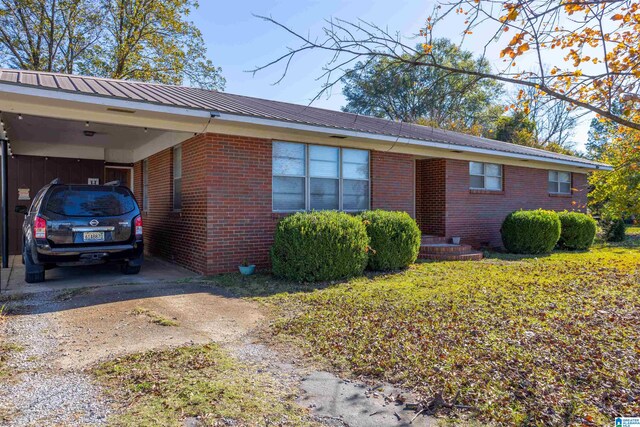 view of side of home featuring a carport