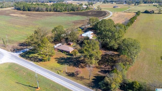 birds eye view of property with a rural view