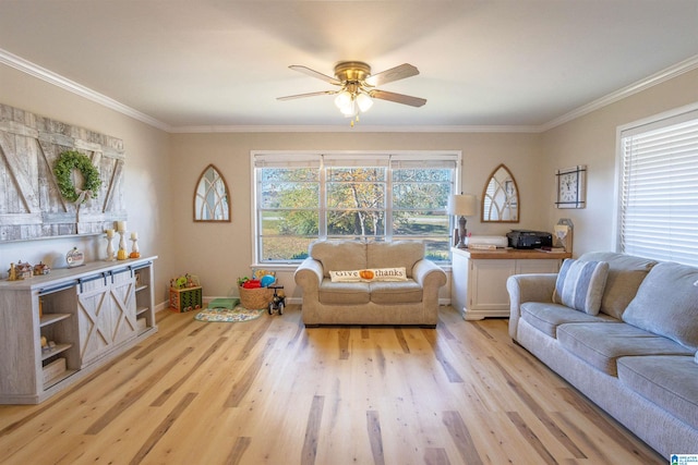 living room with light hardwood / wood-style floors, ceiling fan, and ornamental molding