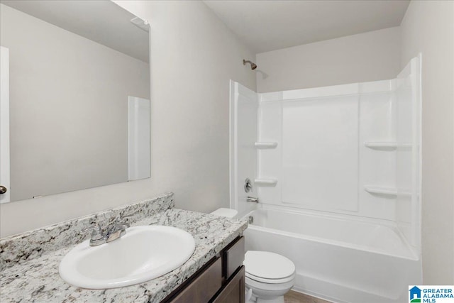 full bathroom with vanity, shower / bathtub combination, and toilet