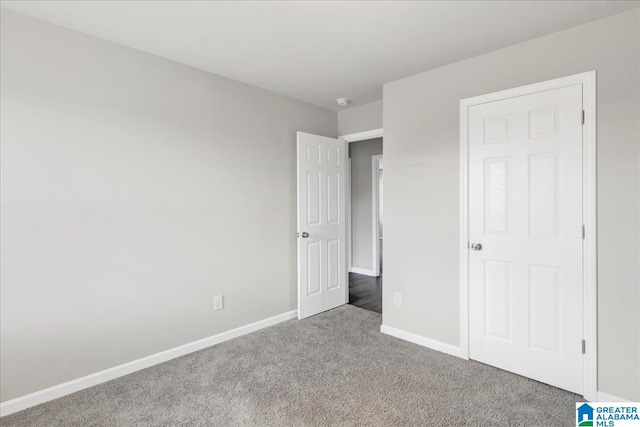 unfurnished bedroom with carpet flooring