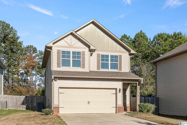 craftsman house featuring cooling unit and a garage