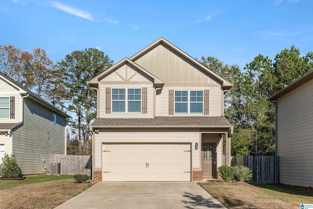 craftsman-style house featuring central AC and a garage