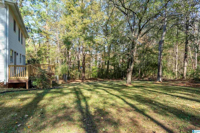 view of yard featuring a wooden deck