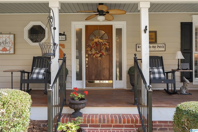 doorway to property with ceiling fan and a porch