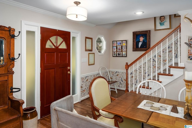 dining area featuring hardwood / wood-style floors and crown molding