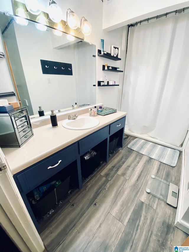 bathroom featuring hardwood / wood-style floors and vanity