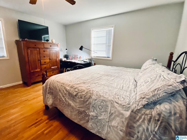 bedroom with ceiling fan and light hardwood / wood-style floors