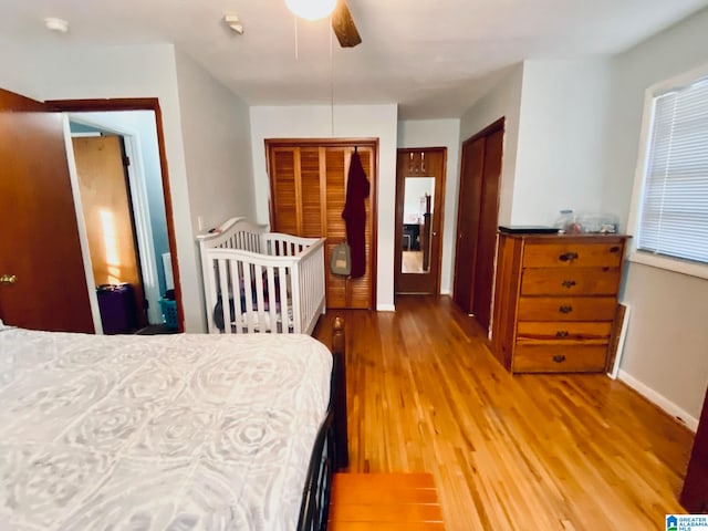 bedroom with ceiling fan and light hardwood / wood-style flooring