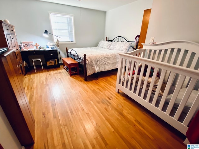 bedroom with light hardwood / wood-style flooring