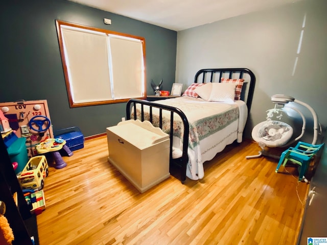 bedroom with light hardwood / wood-style floors